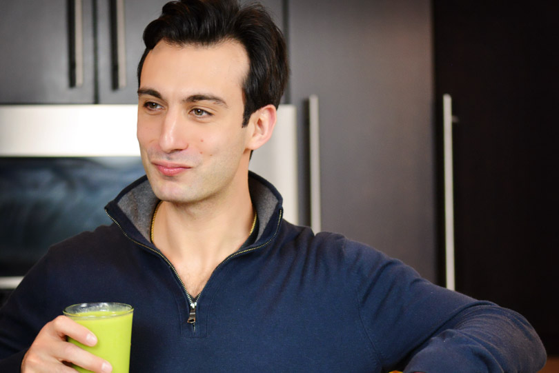 Lenny Gale smiling with a green smoothie.